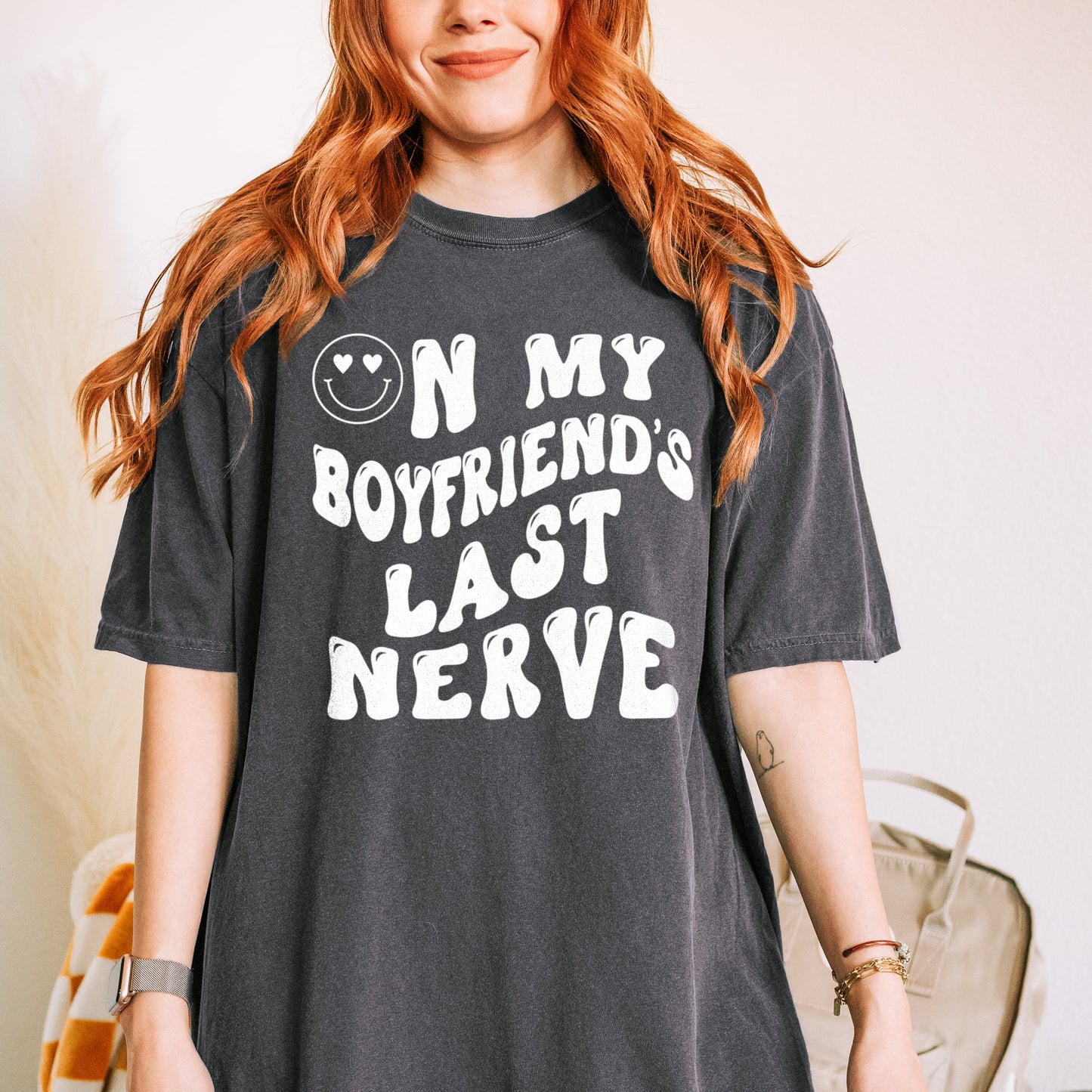 a young woman wearing an on my boyfriend's last nerve tee in pepper