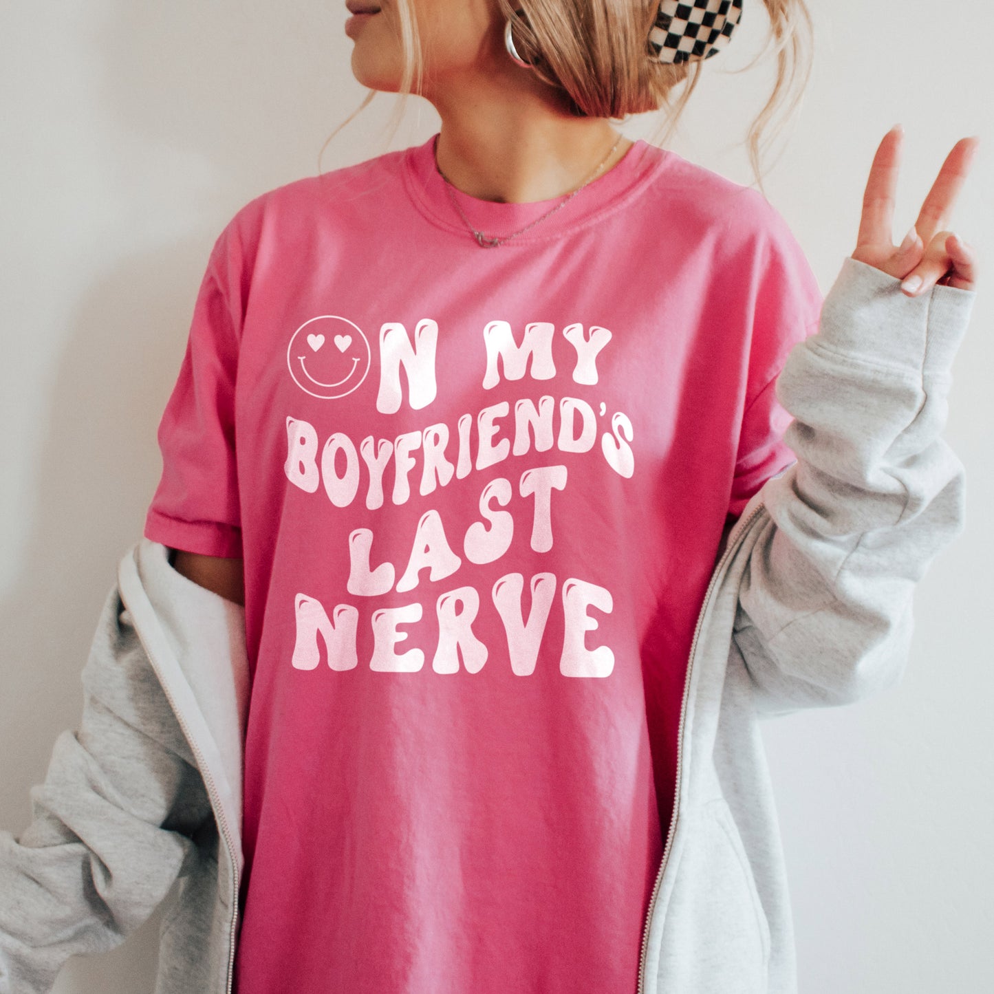 
                  
                    a young woman wearing an on my boyfriend's last nerve tee in crunchberry
                  
                