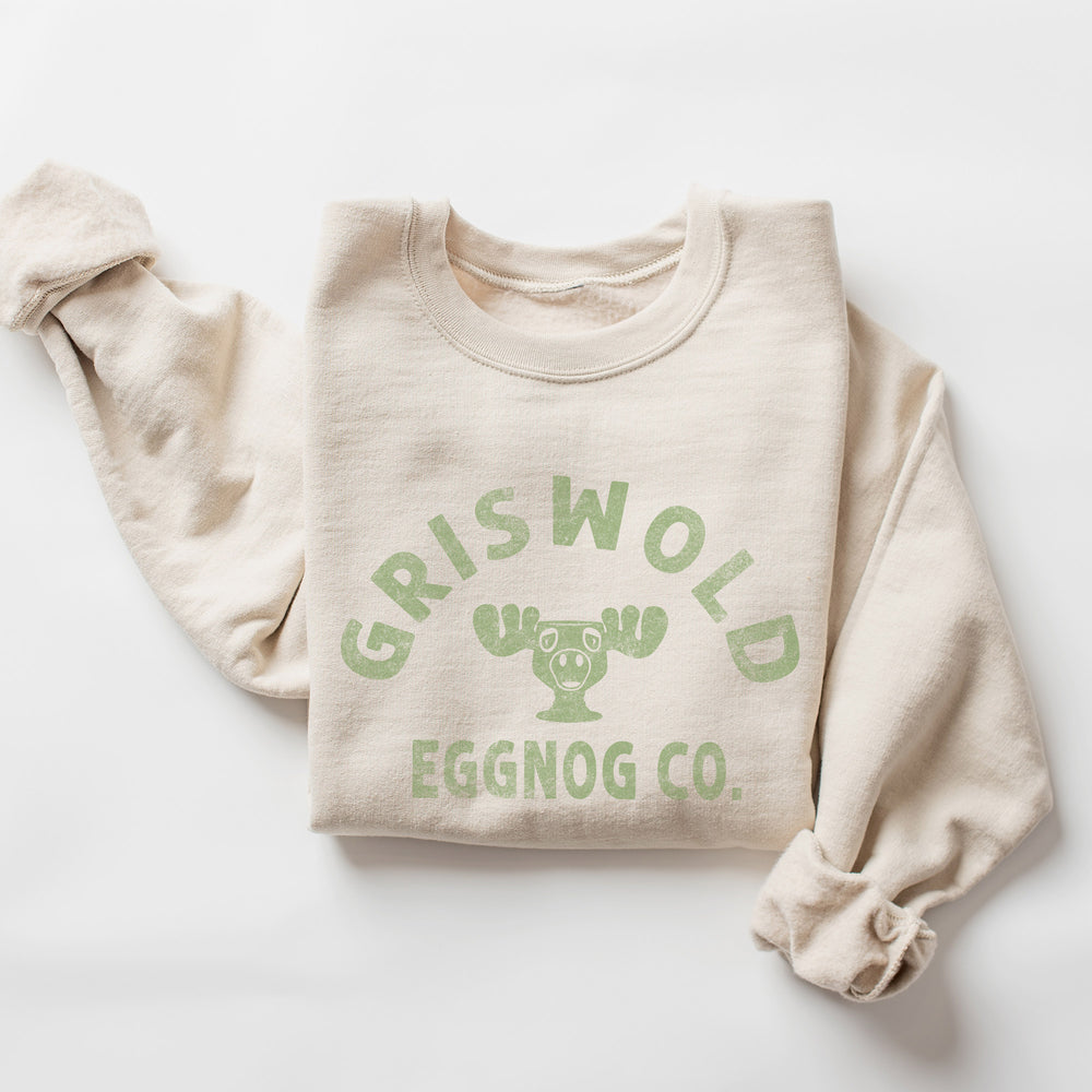 A folded Griswold eggnog Co. sweatshirt in Sand