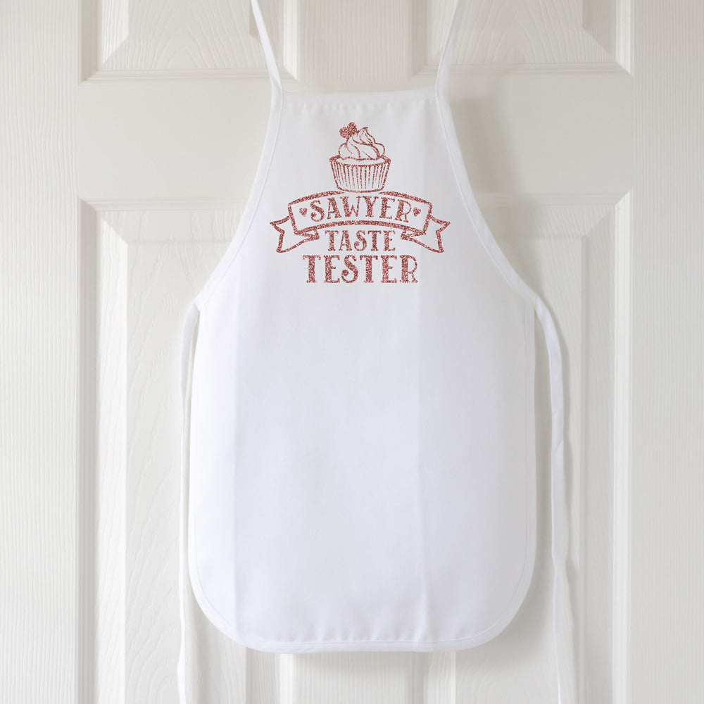
                  
                    a personalized kid's cupcake taste tester apron in white
                  
                