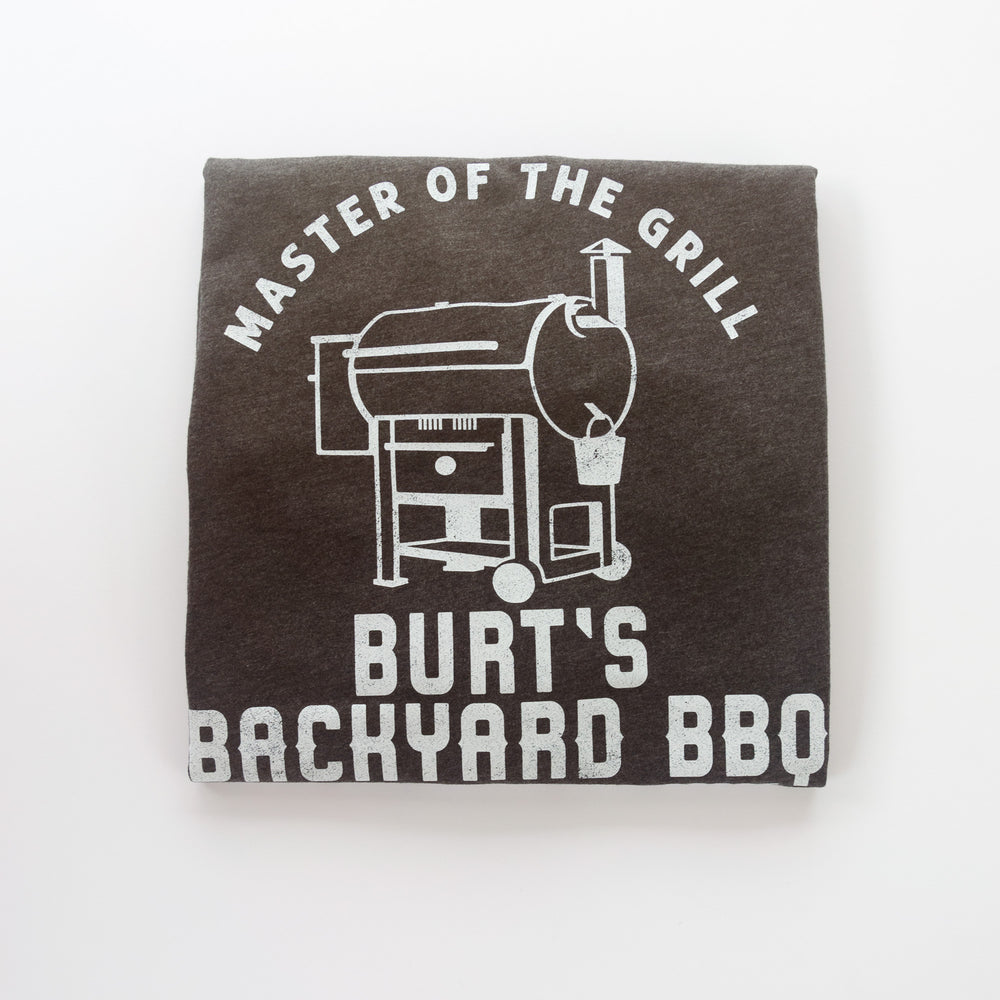 
                  
                    a folded, personalized grilling shirt in dark grey
                  
                