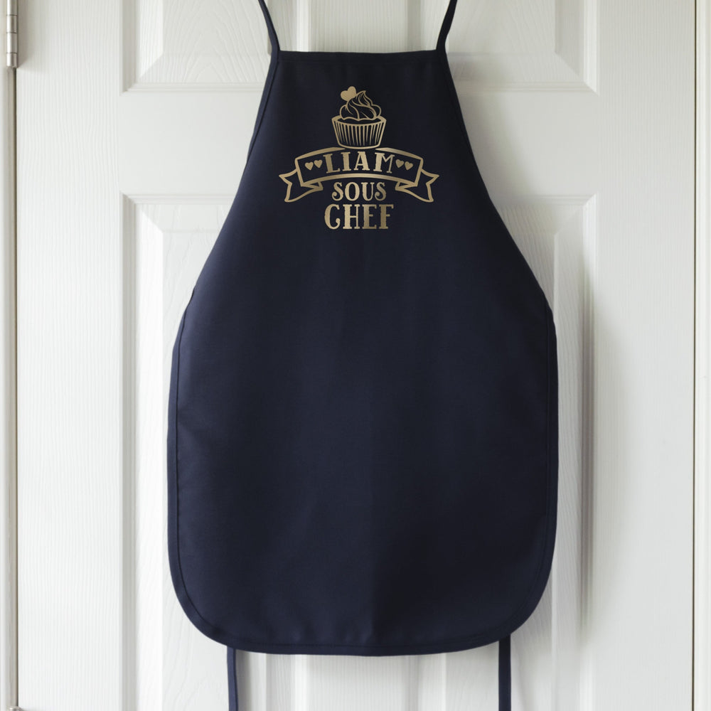 
                  
                    a personalized kid's cupcake taste tester apron in navy
                  
                