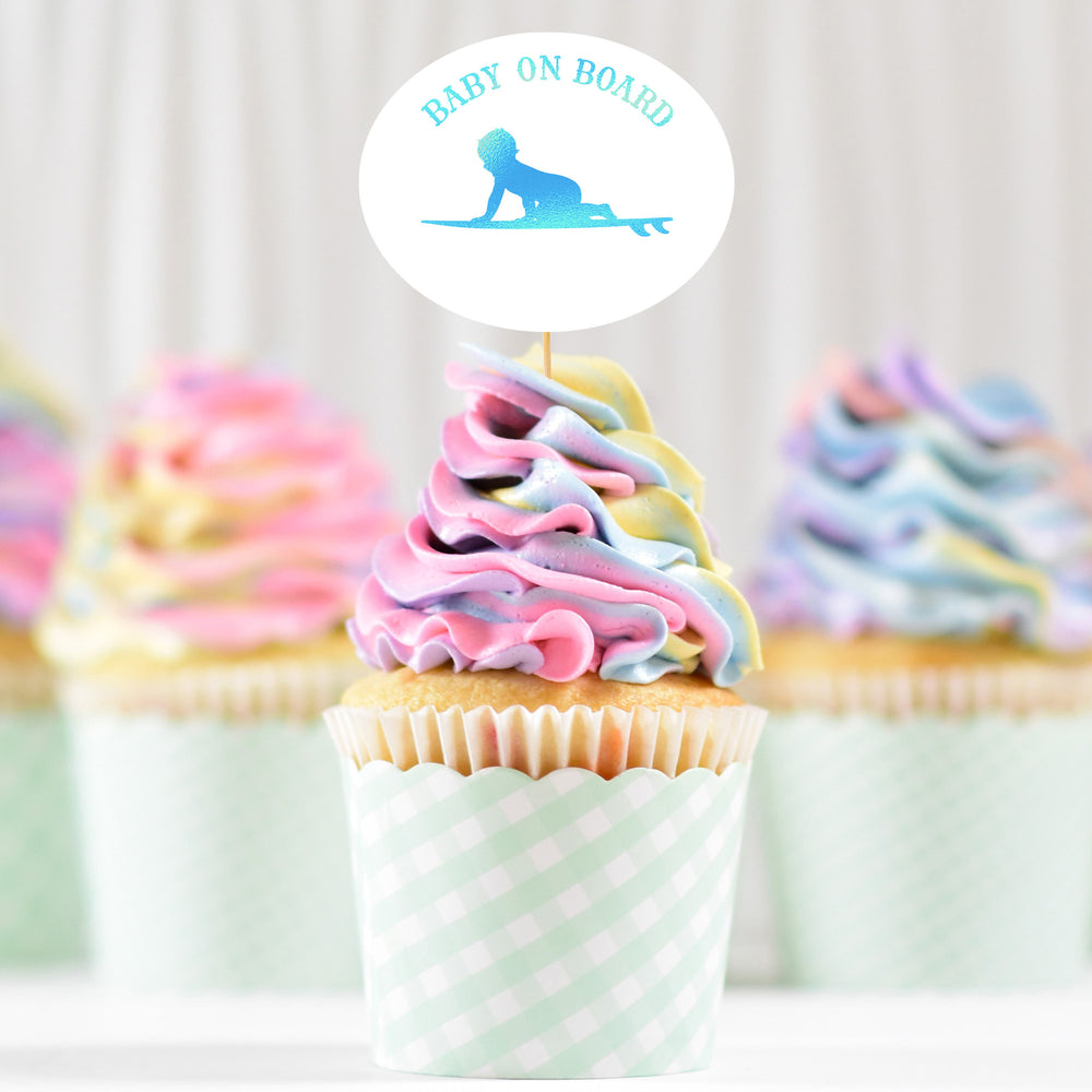
                  
                    pastel swirl cupcakes with a Baby On Board - Surf Boy svg topper printed in holographic blue
                  
                