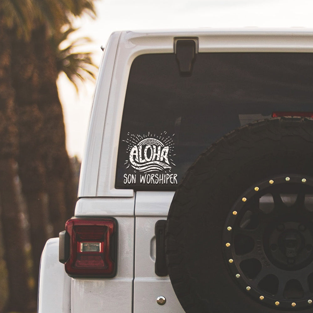 
                  
                    aloha son worshiper svg decal on a whte Jeep in the tropics
                  
                