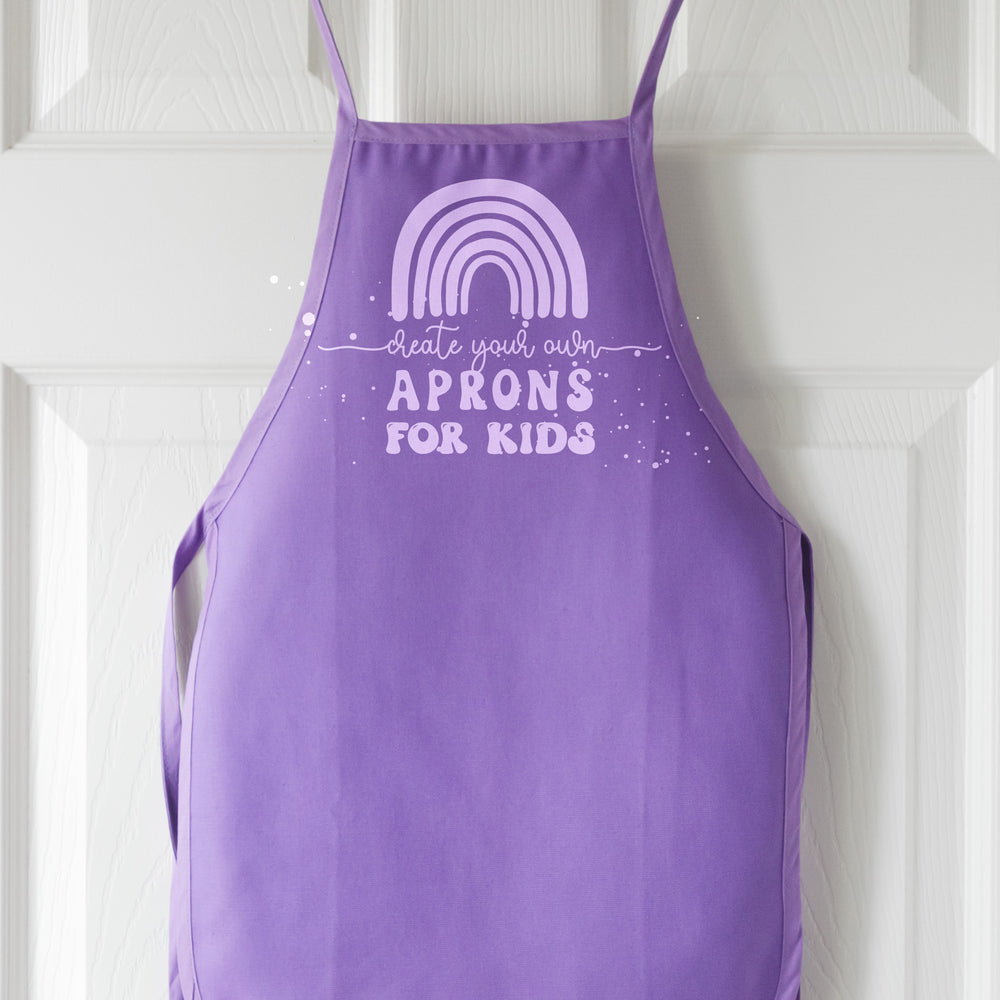 
                  
                    a kids apron in purple
                  
                