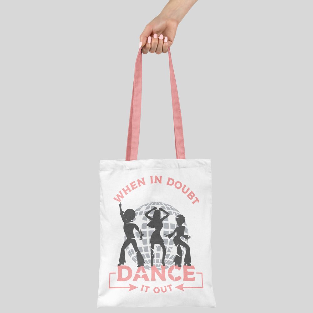 
                  
                    a hand holding a carry bag printed with when-in-doubt-dance-it-out-svg
                  
                