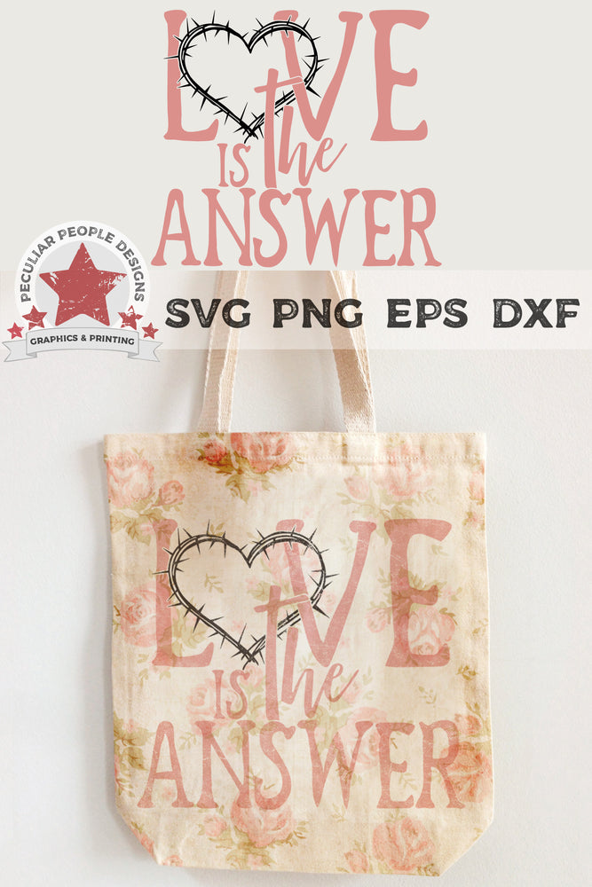 
                  
                    love is the answer svg printed on a tote bag with a vintage floral pattern
                  
                