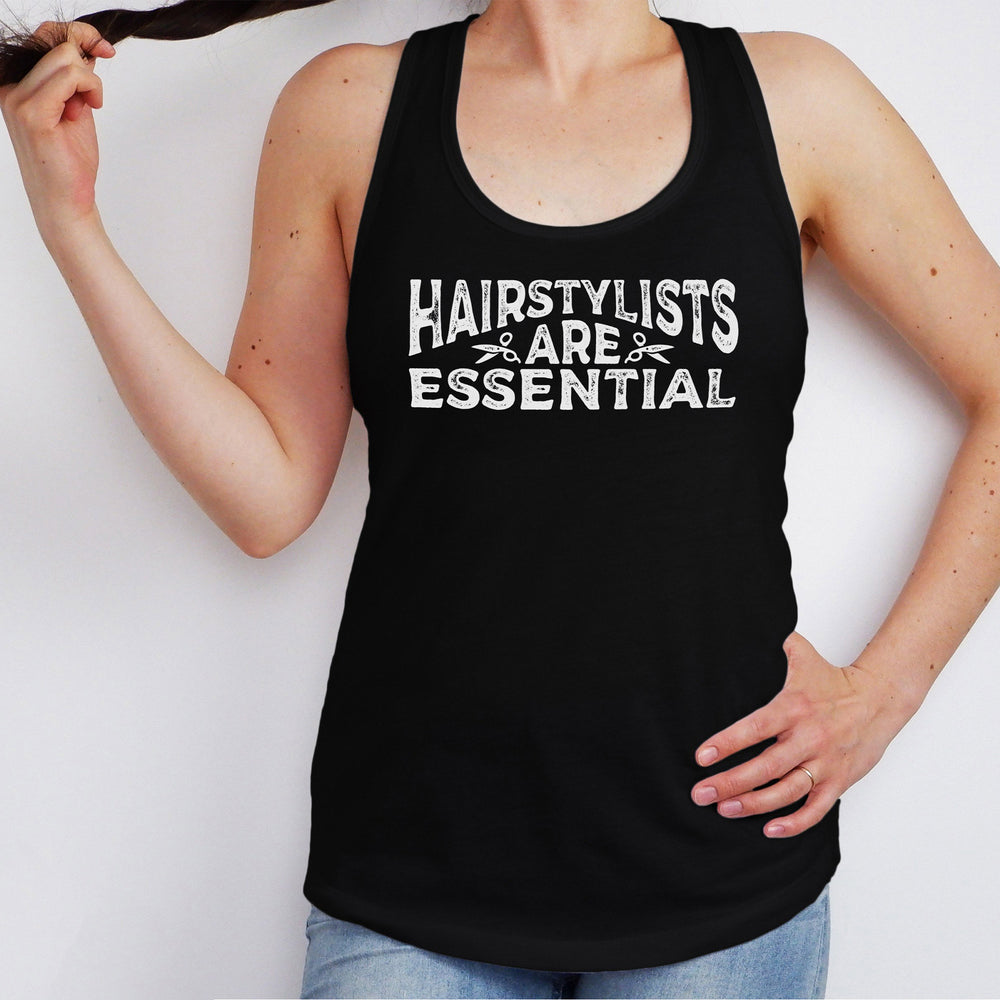 A young woman wearing a black hairstylists are essential tank top