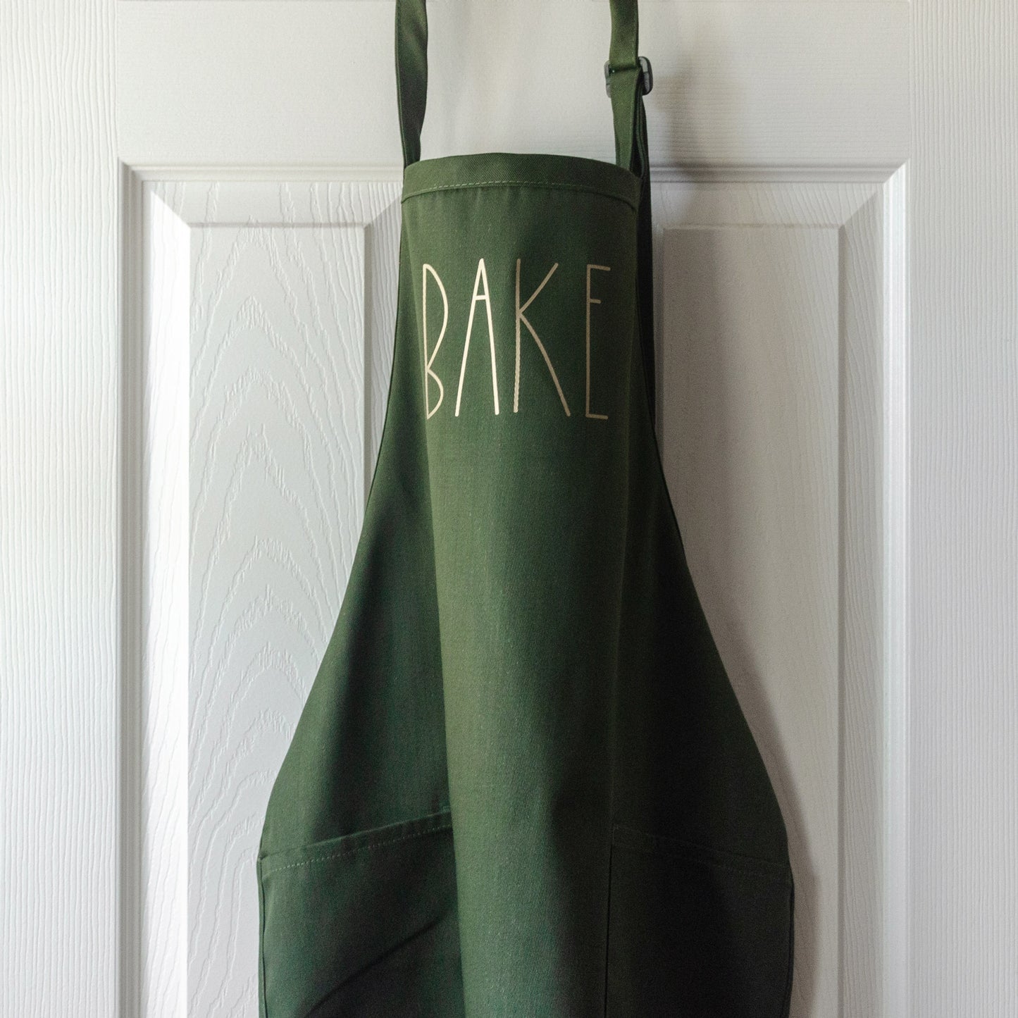 a Bake apron in green