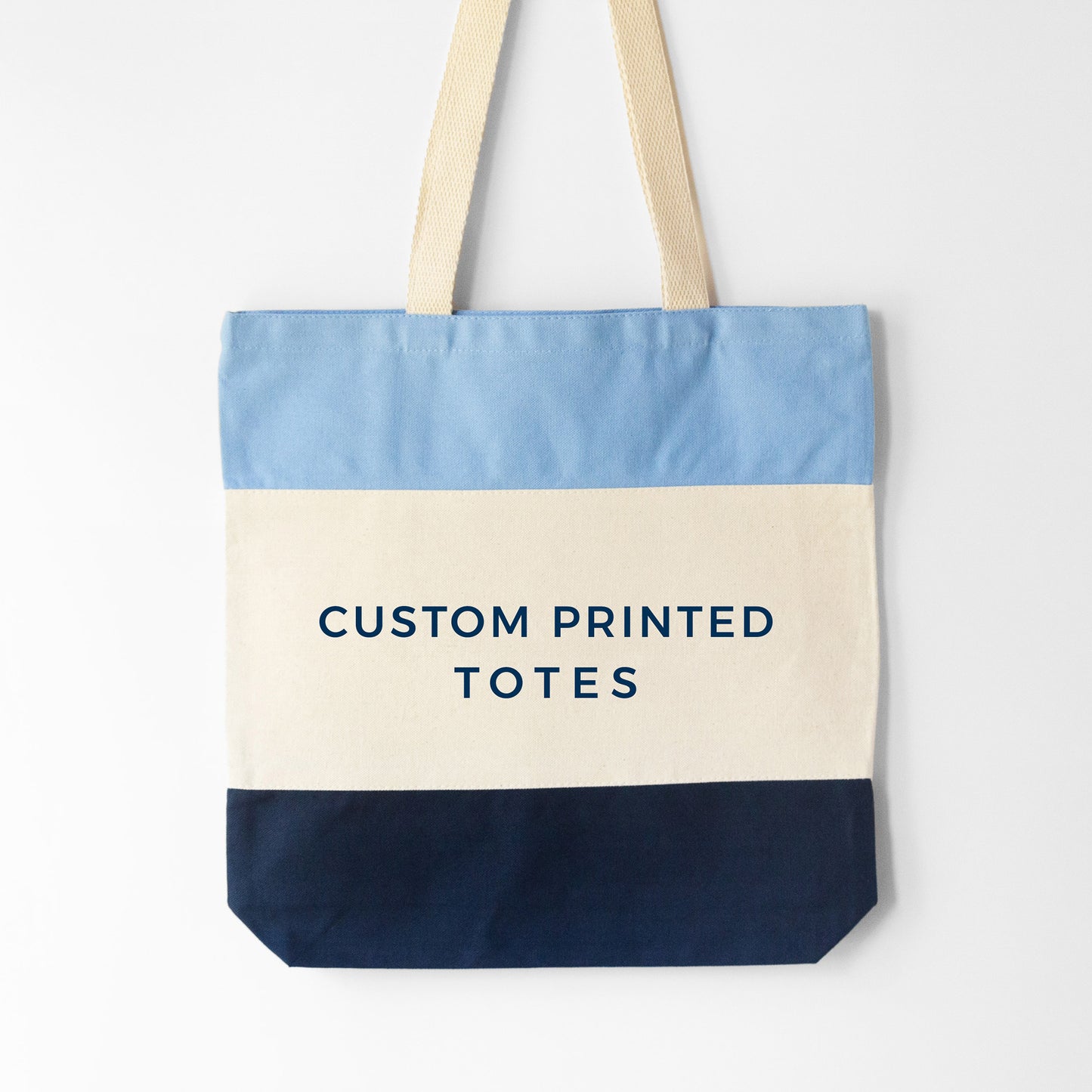 
                  
                    Design your own tri-color tote, shown in blue
                  
                