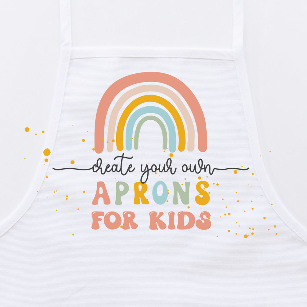 
                  
                    A white apron with colorful text reading "Create your own aprons for kids".
                  
                