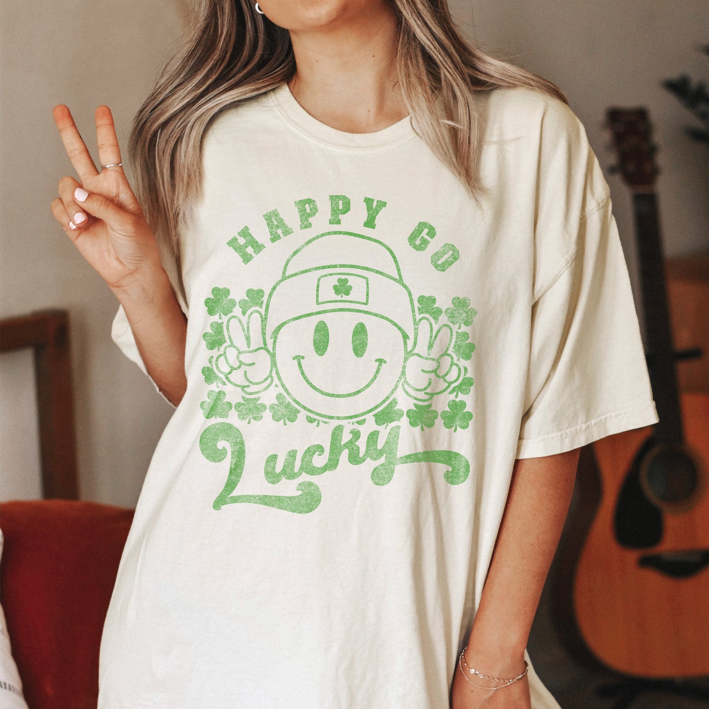 a young woman wearing an oversized happy go lucky tee in Ivory