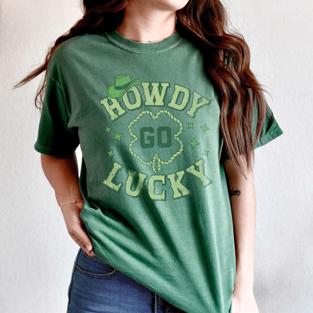 a young woman wearing a howdy go lucky tee in light green