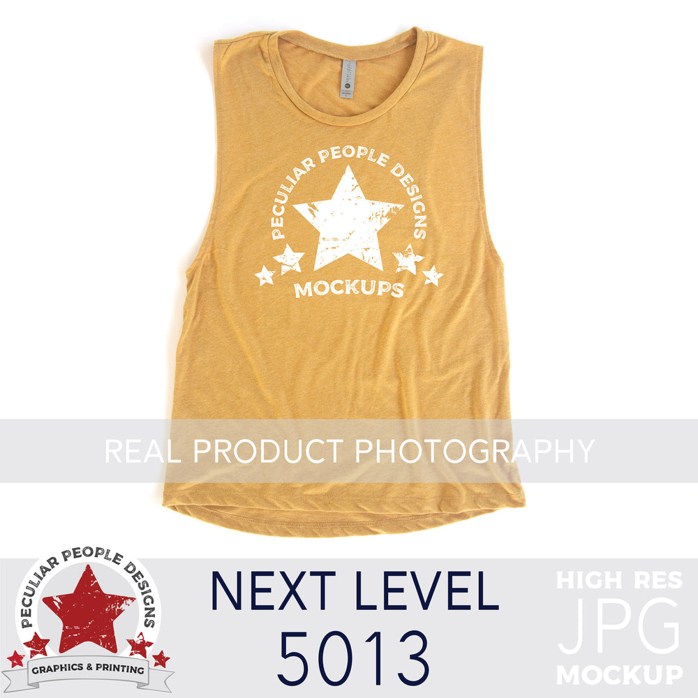 an antique gold, next level 5013 muscle tank flat lay mockup with a white background by peculiar people designs