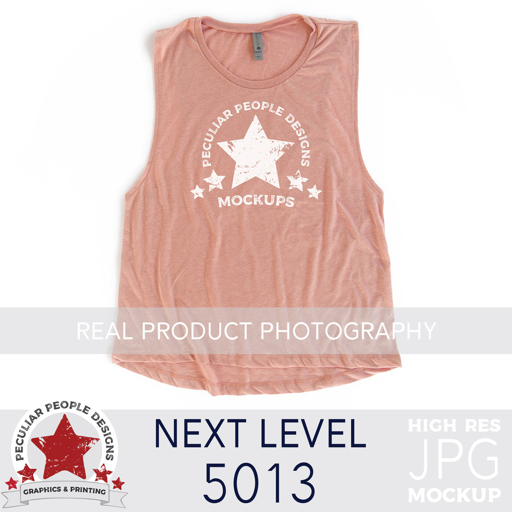 
                  
                    a Desert Pink, next level 5013 muscle tank flat lay mockup with a white background by peculiar people designs
                  
                