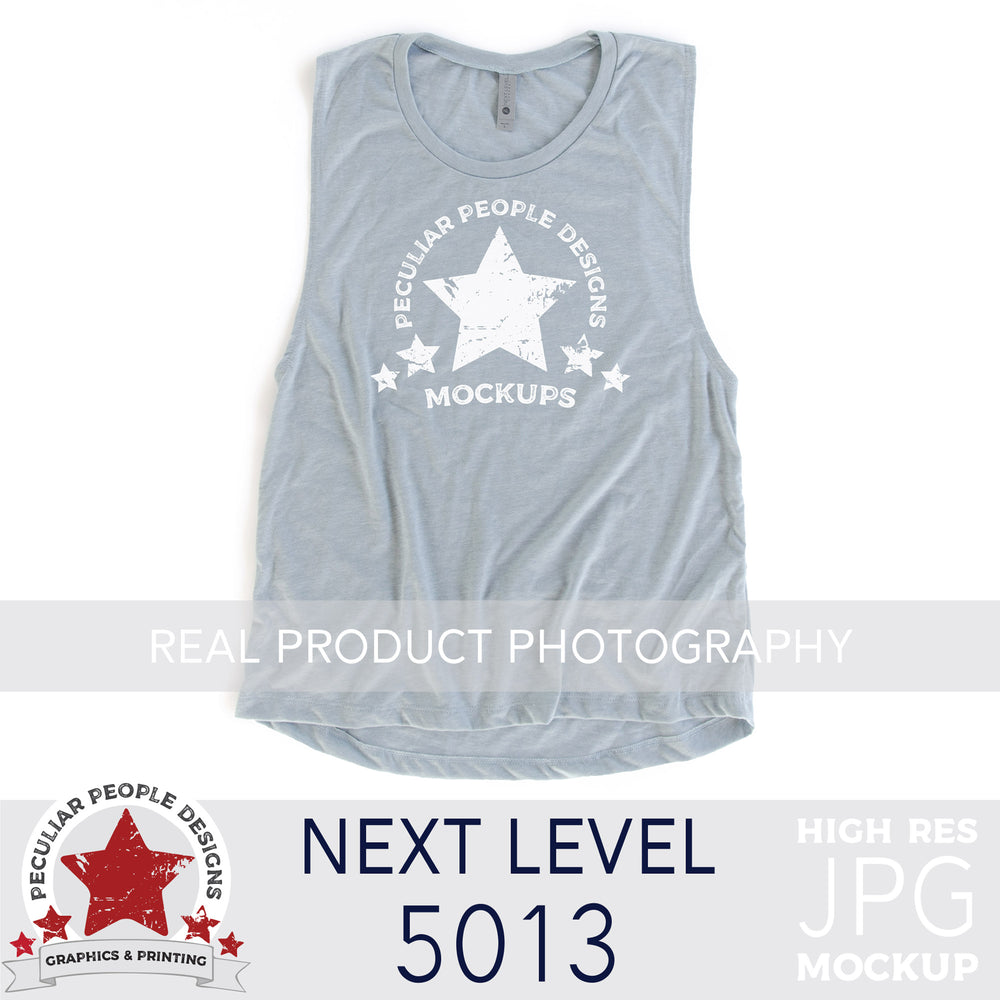 
                  
                    a Stonewash Blue, next level 5013 muscle tank flat lay mockup with a white background by peculiar people designs
                  
                
