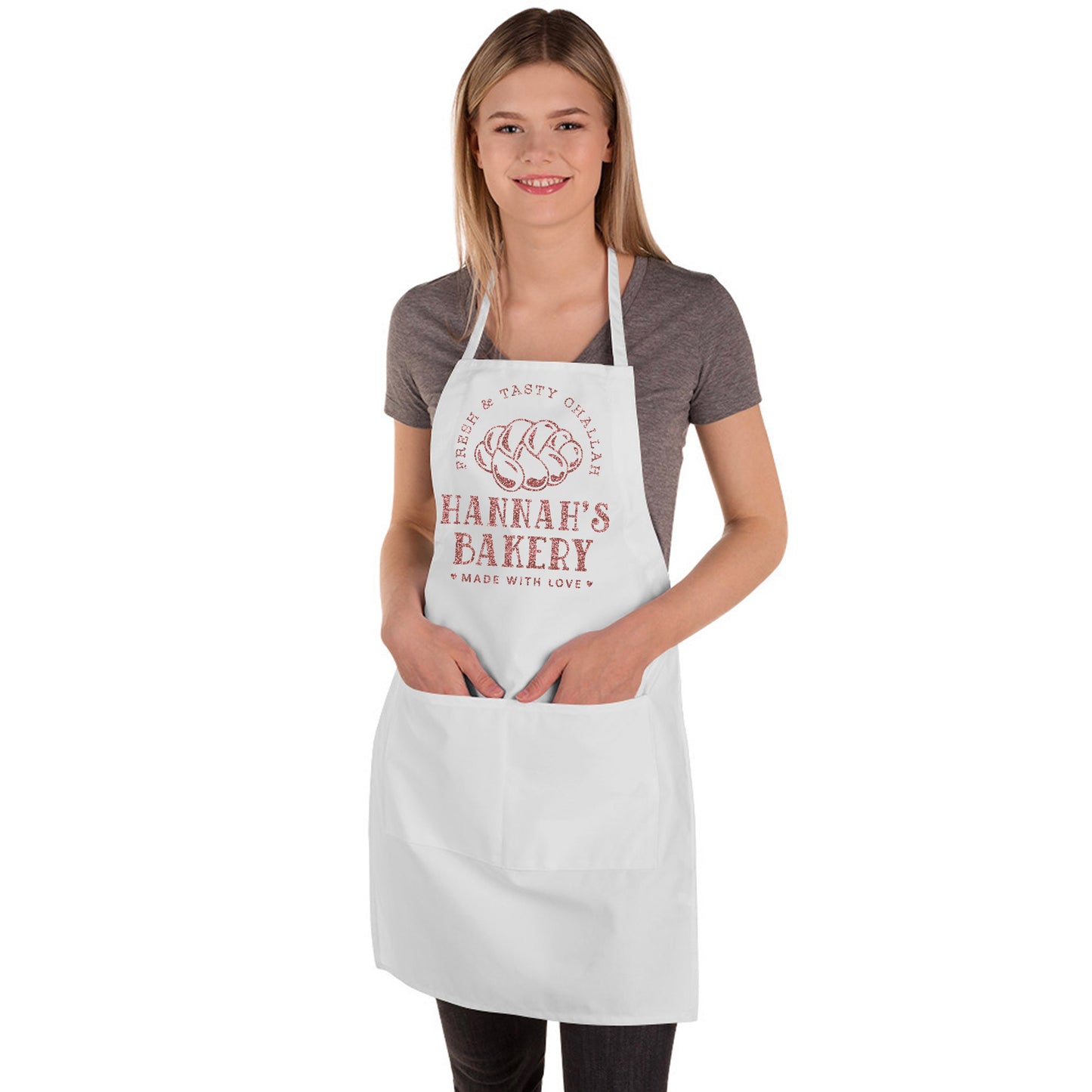 
                  
                    a young woman wearing a personalized challah baking apron in white butcher 
                  
                