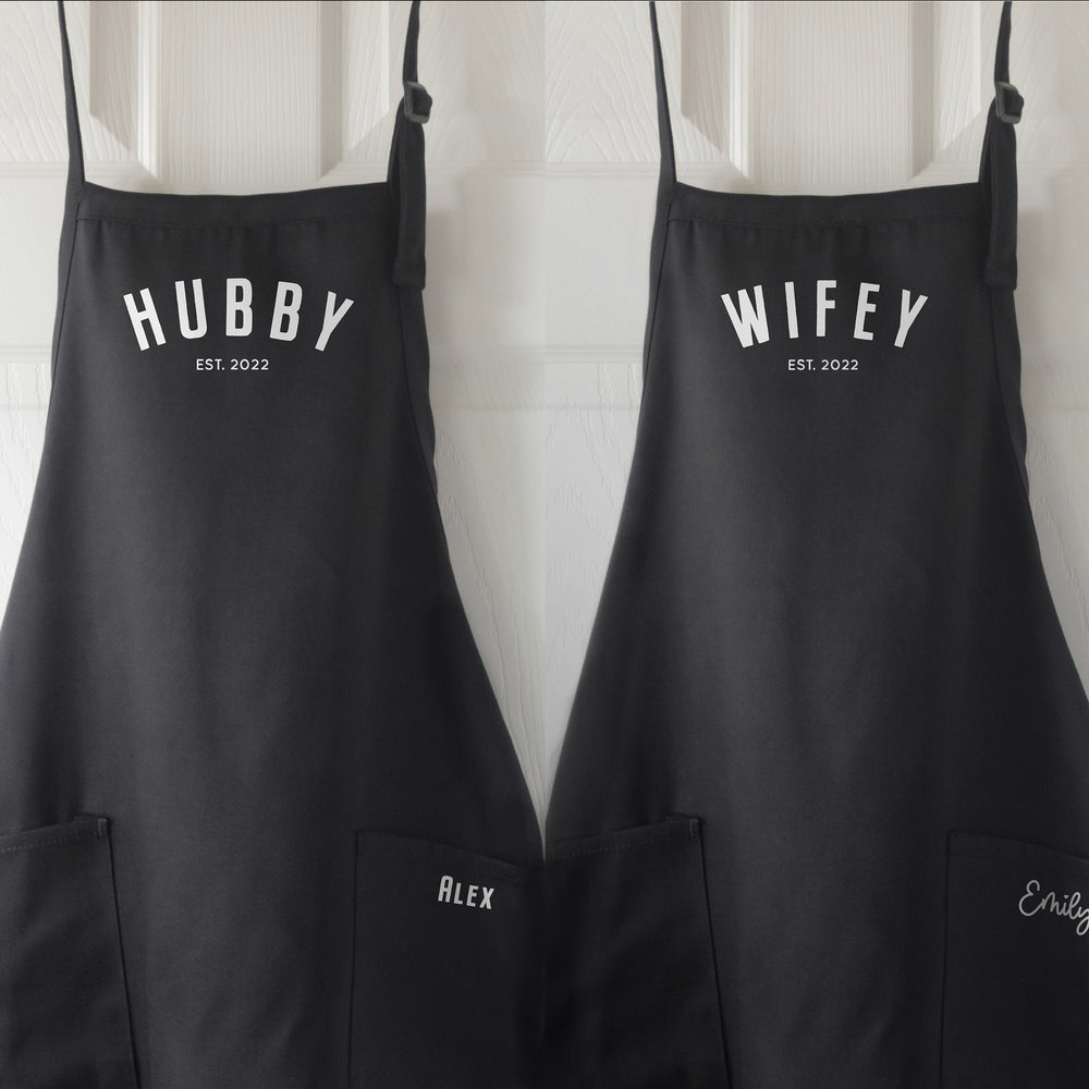 
                  
                    matching set of hubby, wifey aprons in black
                  
                