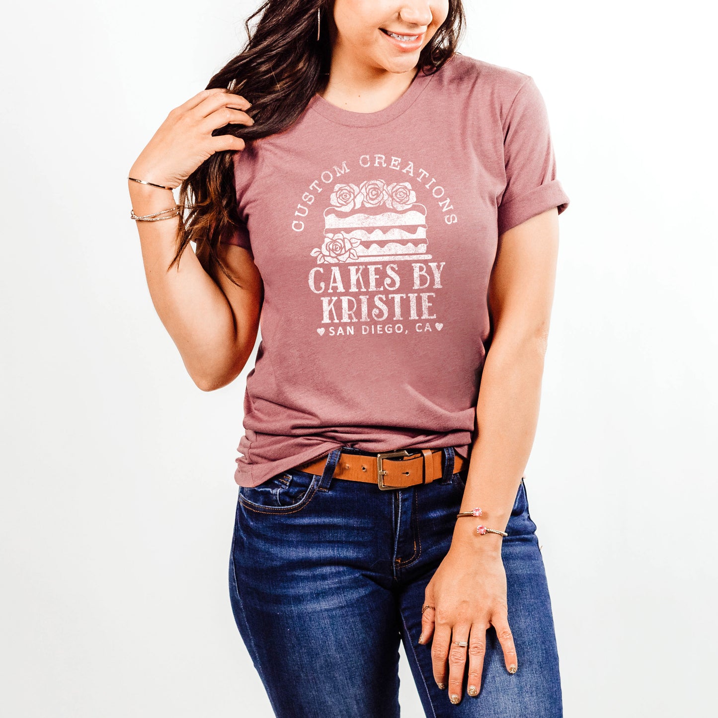 a young woman wearing a personalized cake baker shirt in mauve