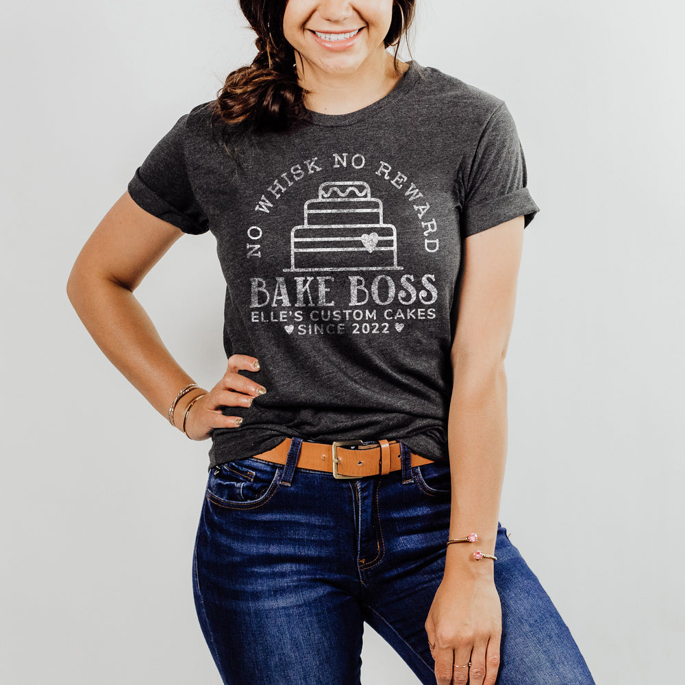 a young woman wearing a personalized wedding cake baker shirt in dark grey