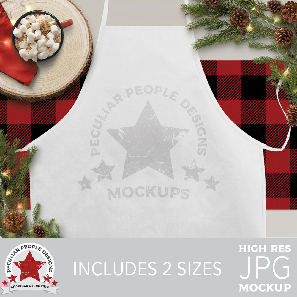 a rustic farmhouse holiday mockup image with hot cocoa, pine cones and branches surrounding a white apron