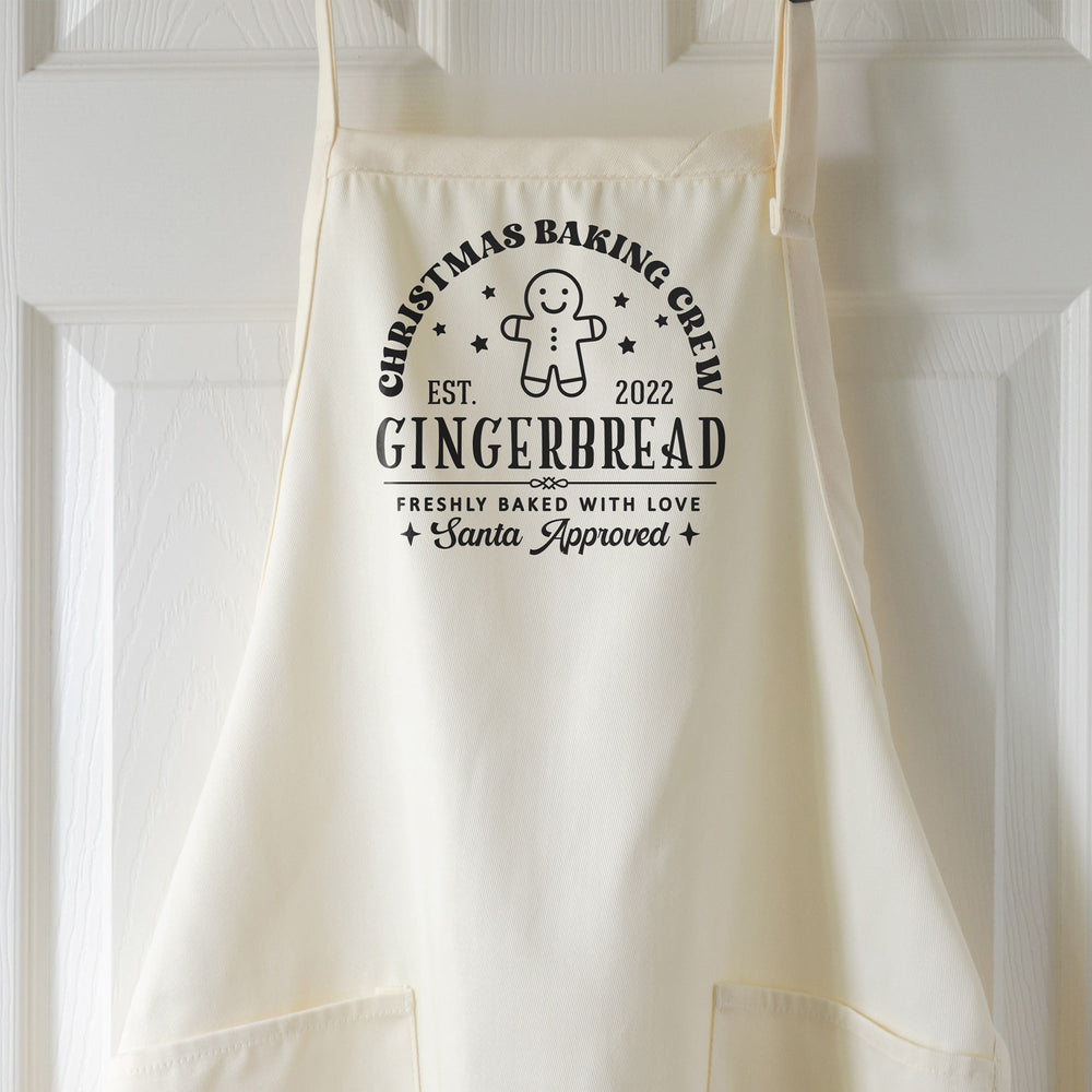 a christmas baking crew apron in natural