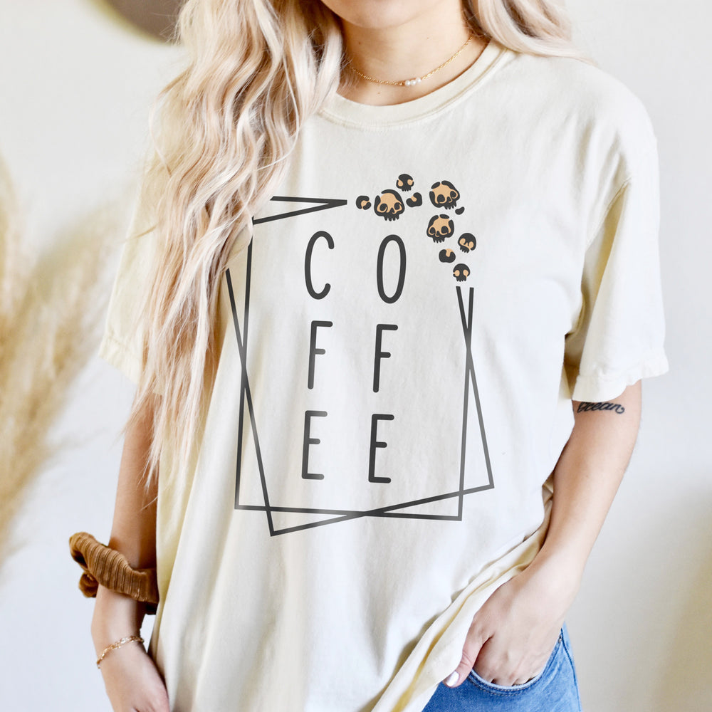 a young woman wearing an oversized coffee shirt in ivory