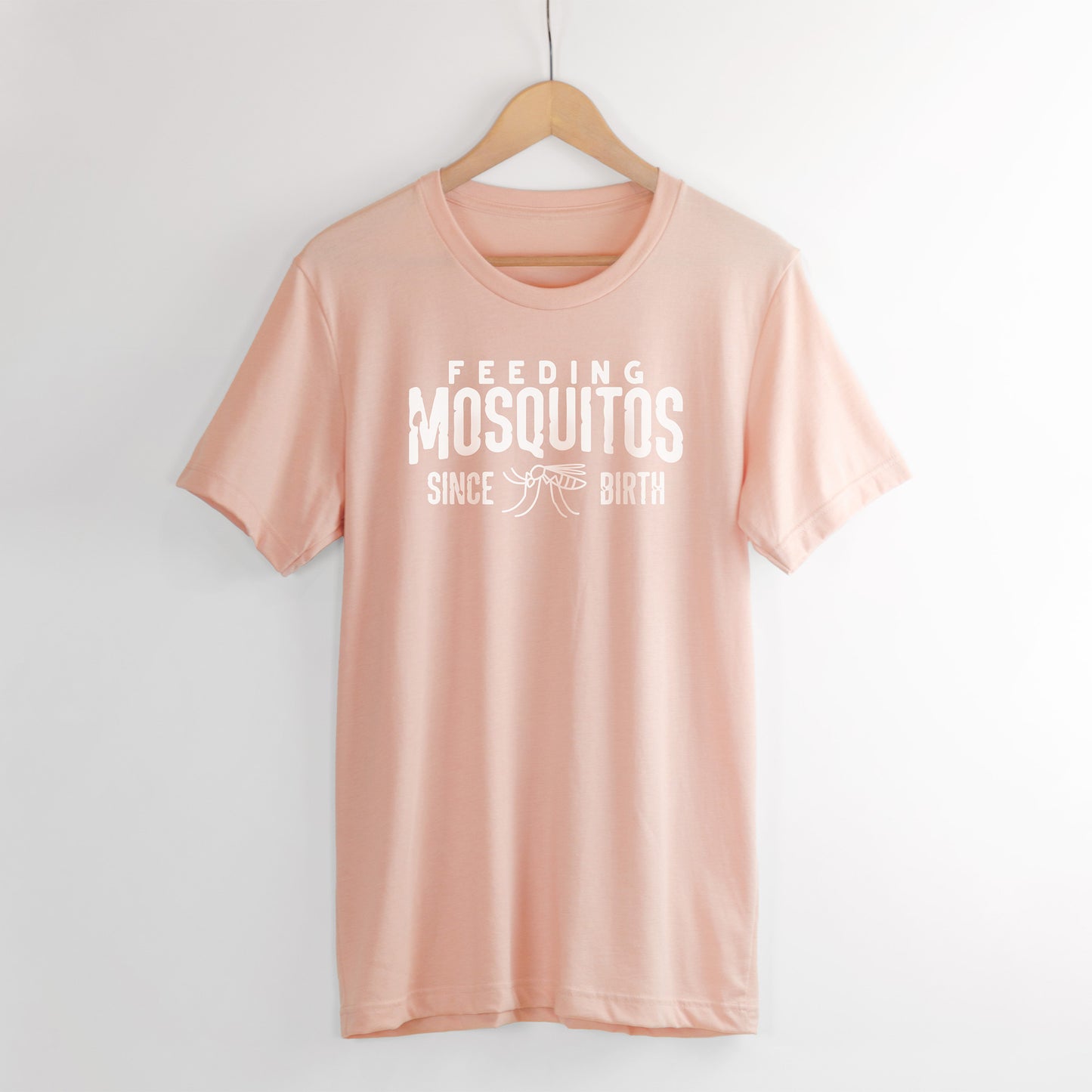 Feeding mosquitos shirt in peach