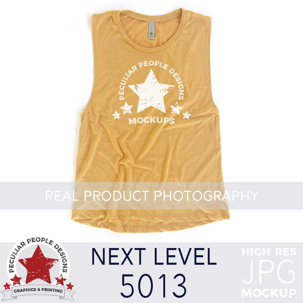 
                  
                    An antique gold, next level 5013 muscle tank flat lay mockup with a white background by peculiar people designs
                  
                
