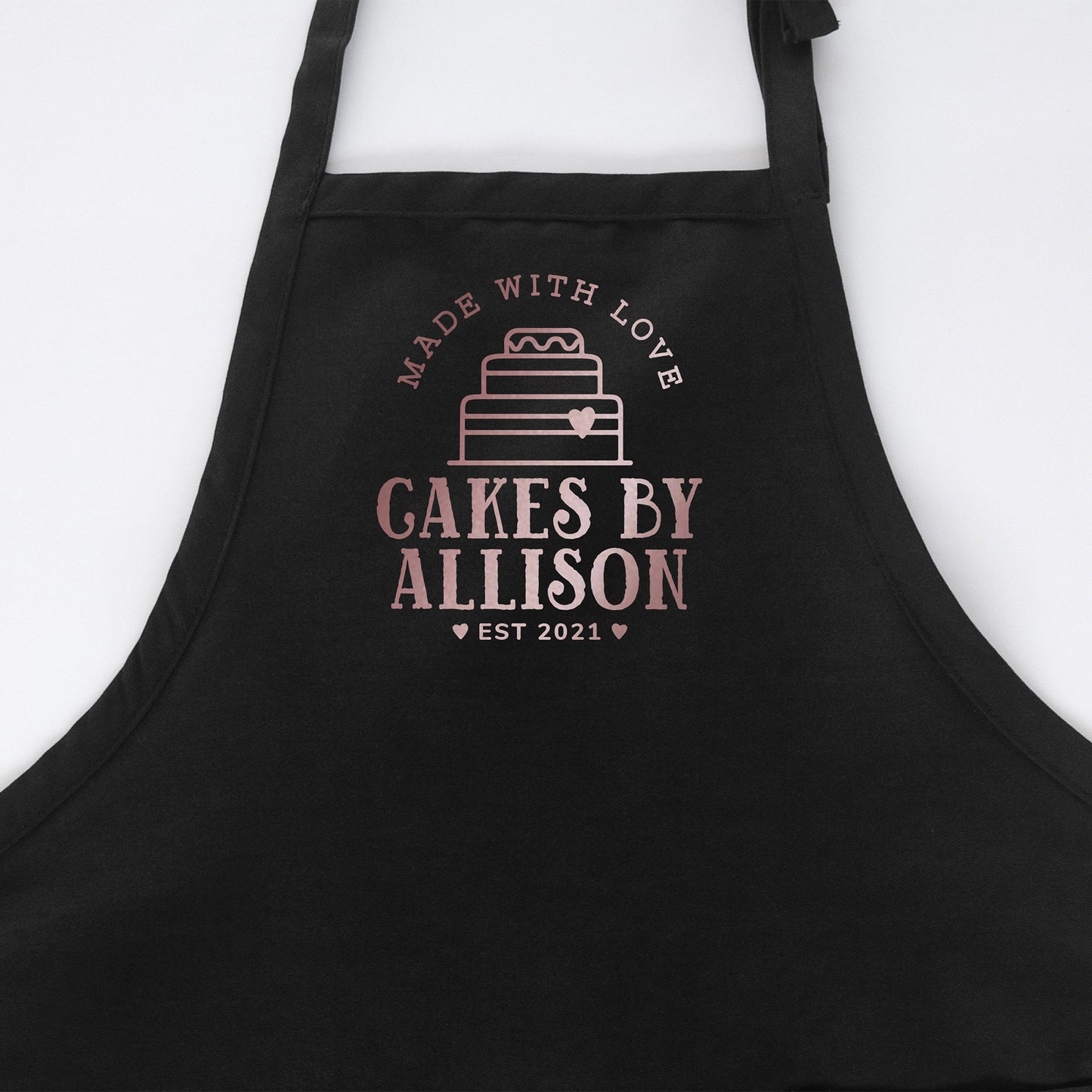 
                  
                    A personalized cake baking apron in black
                  
                