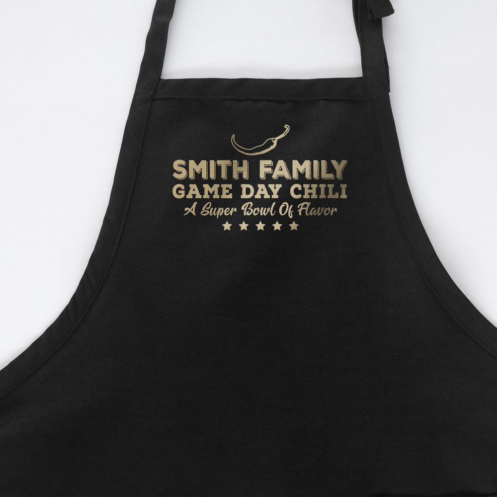 
                  
                    a personalized chili cook off apron in black
                  
                