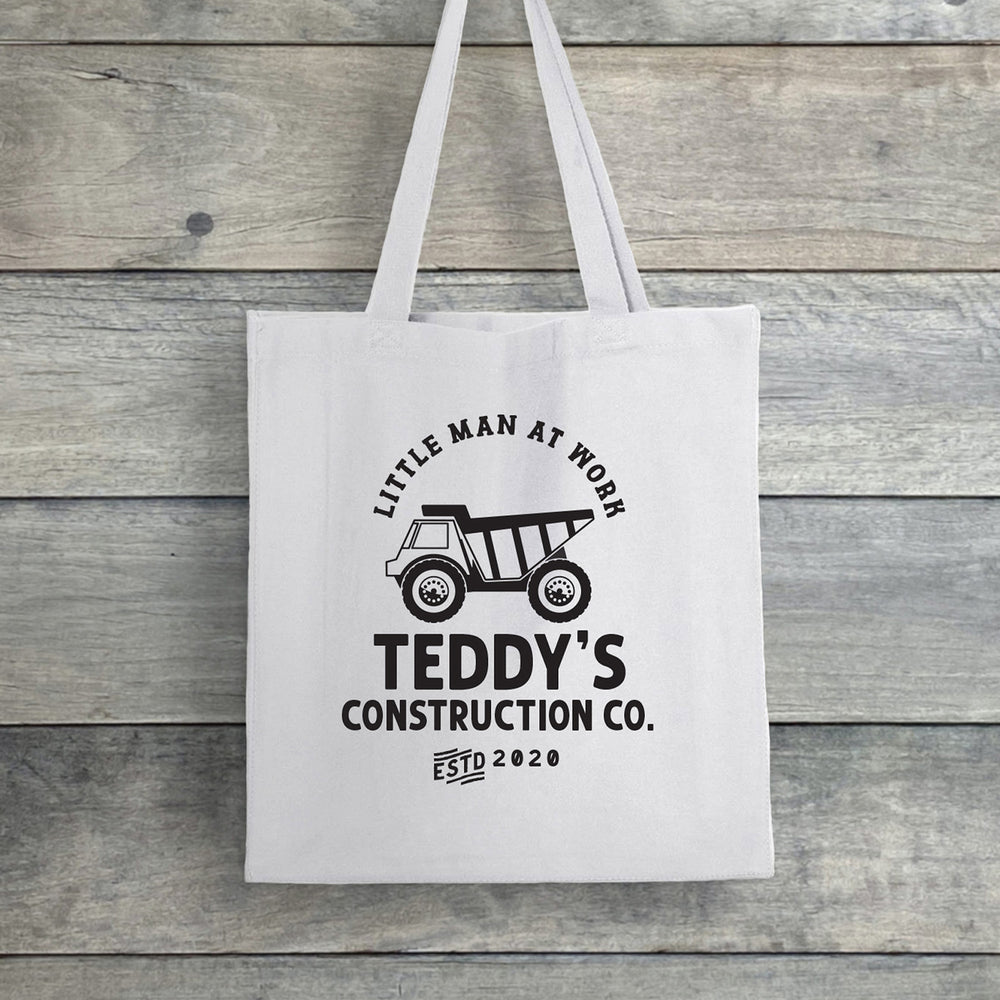 
                  
                    a personalized dump truck tote in white
                  
                