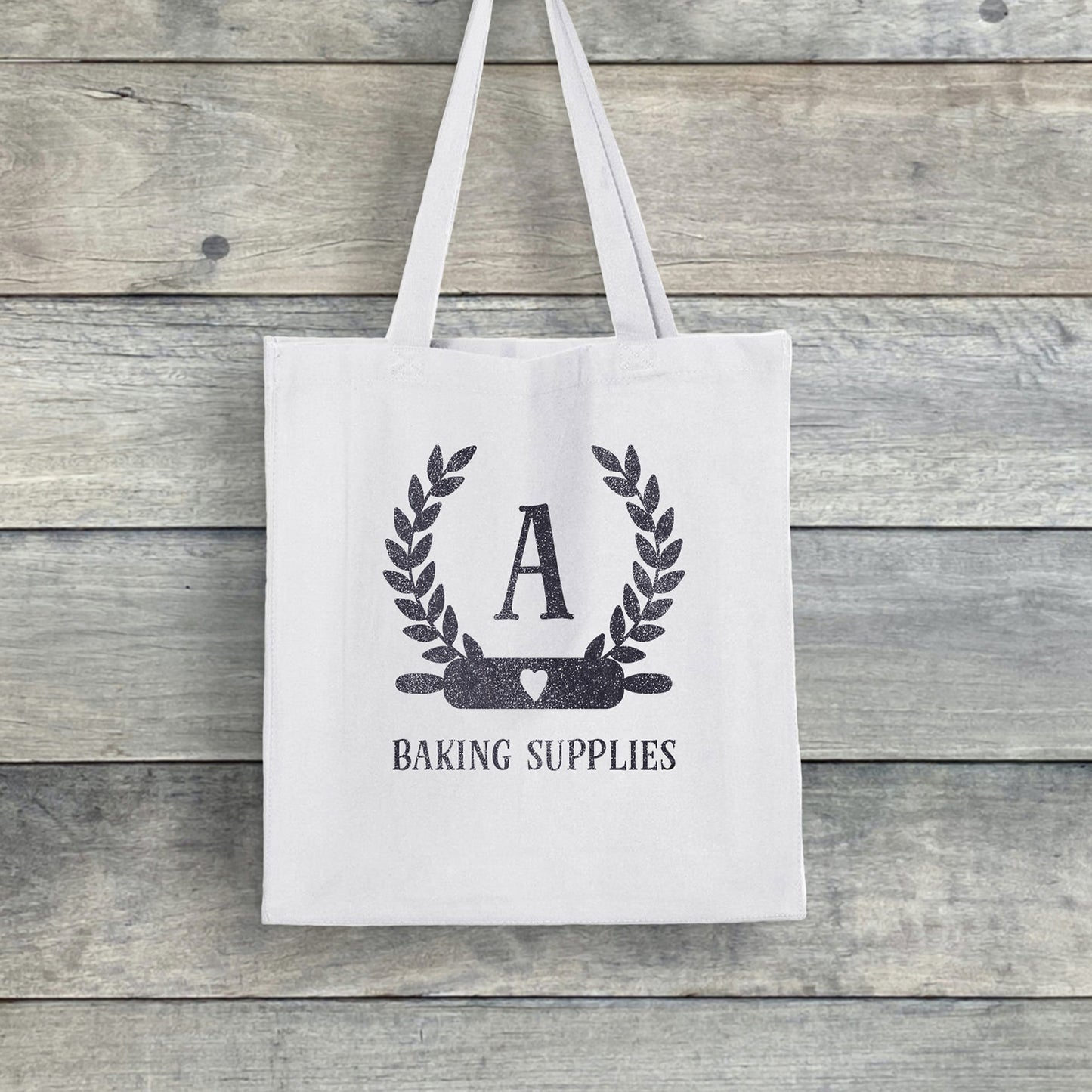 
                  
                    a personalized baking monogram tote in white
                  
                