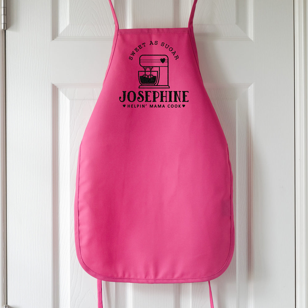 
                  
                    a kids personalized baking apron in hot pink
                  
                