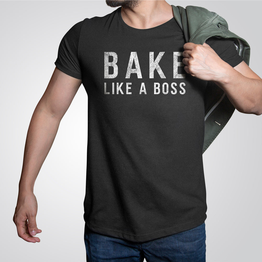 a man wearing a bake like a boss shirt in black