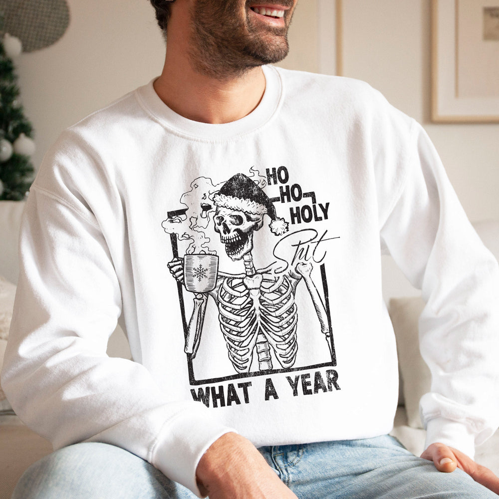 a young man wearing a funny skeleton christmas sweatshirt in white