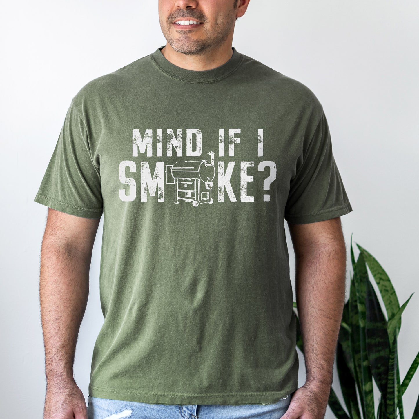 
                  
                    a handsome man wearing a Mind If I Smoke? t-shirt in moss
                  
                