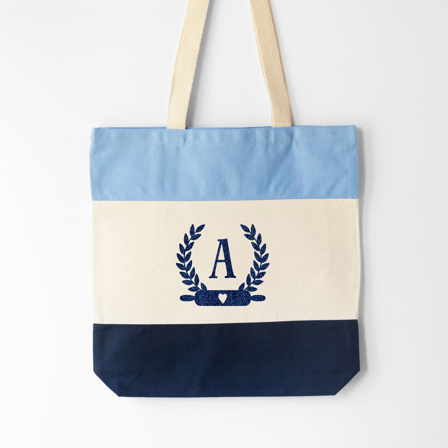 
                  
                    a monogrammed baking tote bag in blue
                  
                