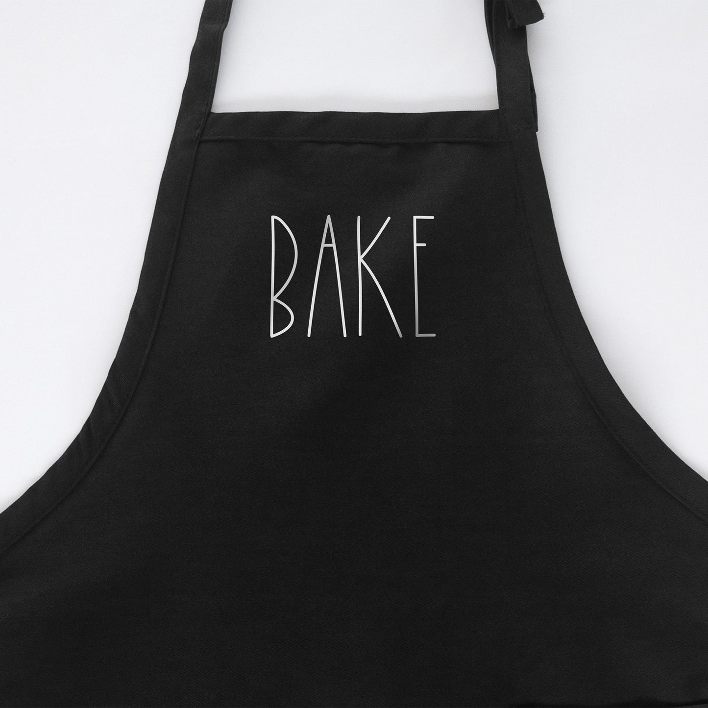 
                  
                    a Bake apron in black
                  
                