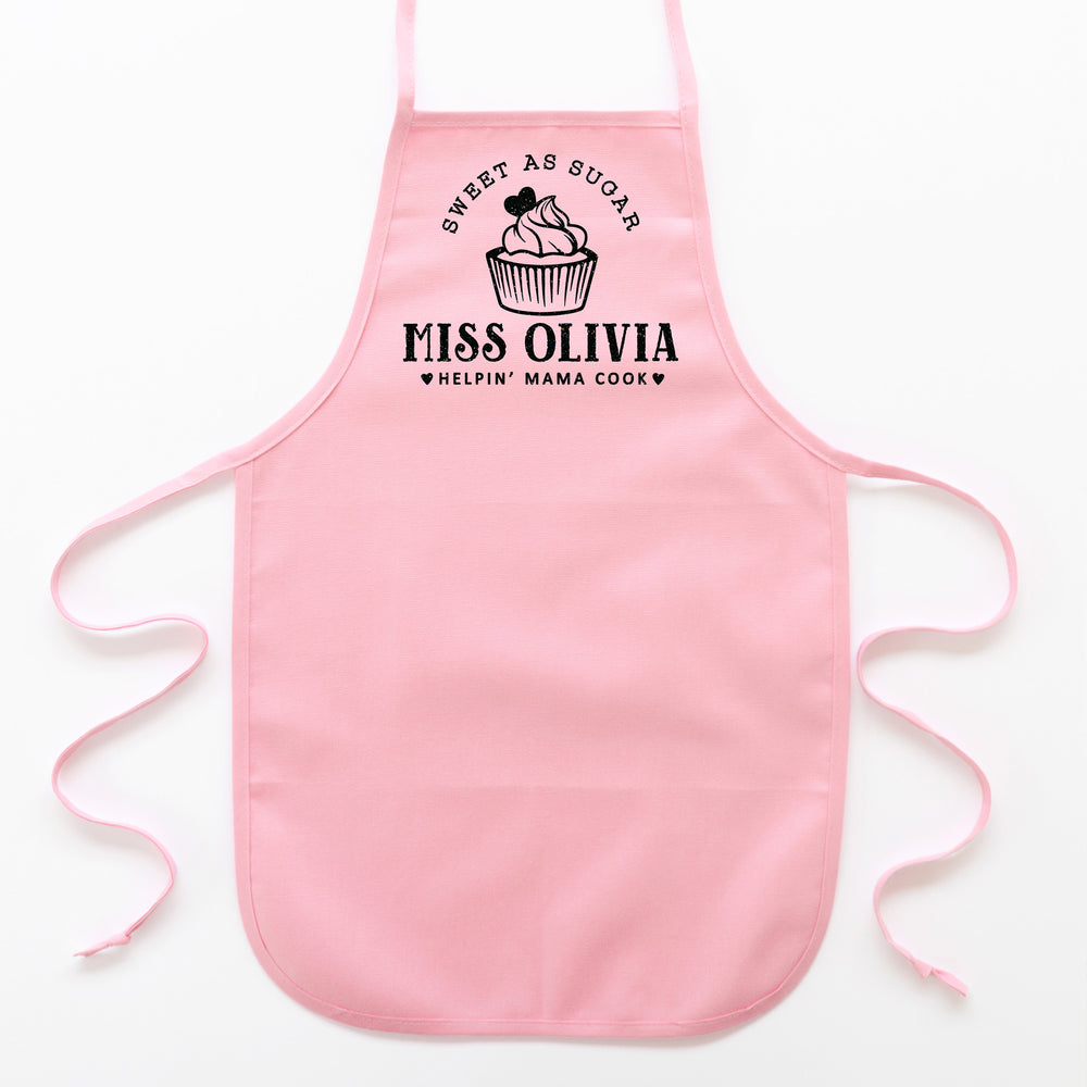 
                  
                    a kid's personalized cupcake baking apron in pink pastel
                  
                