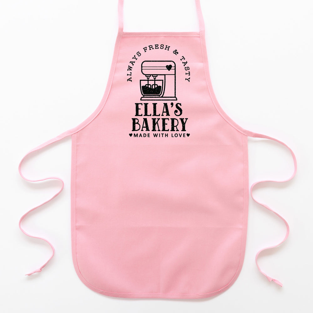 
                  
                    a toddler personalized baking apron in pink pastel
                  
                