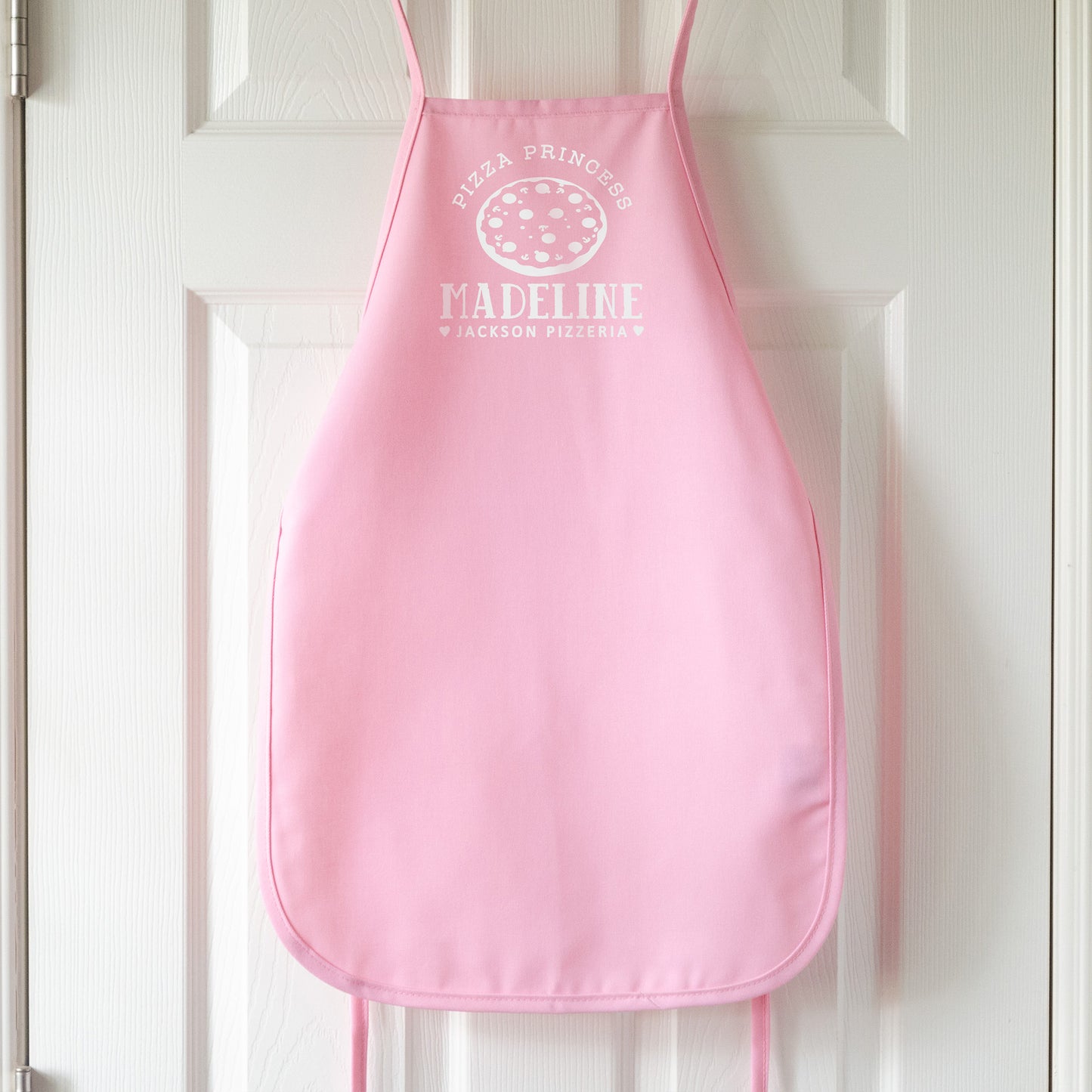 
                  
                    Kid's personalized pizza apron in pink pastel
                  
                