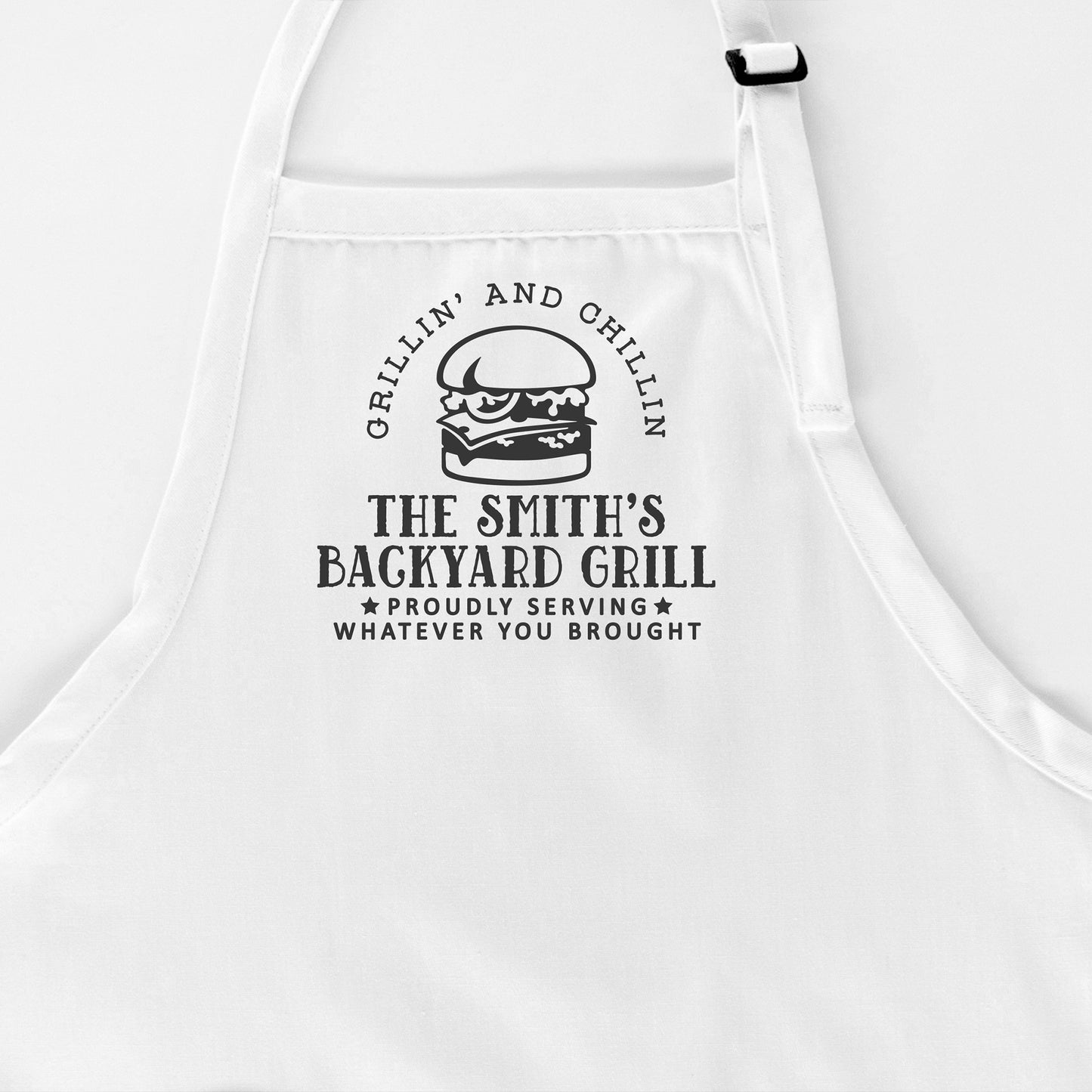 
                  
                    a personalized grilling apron in white
                  
                