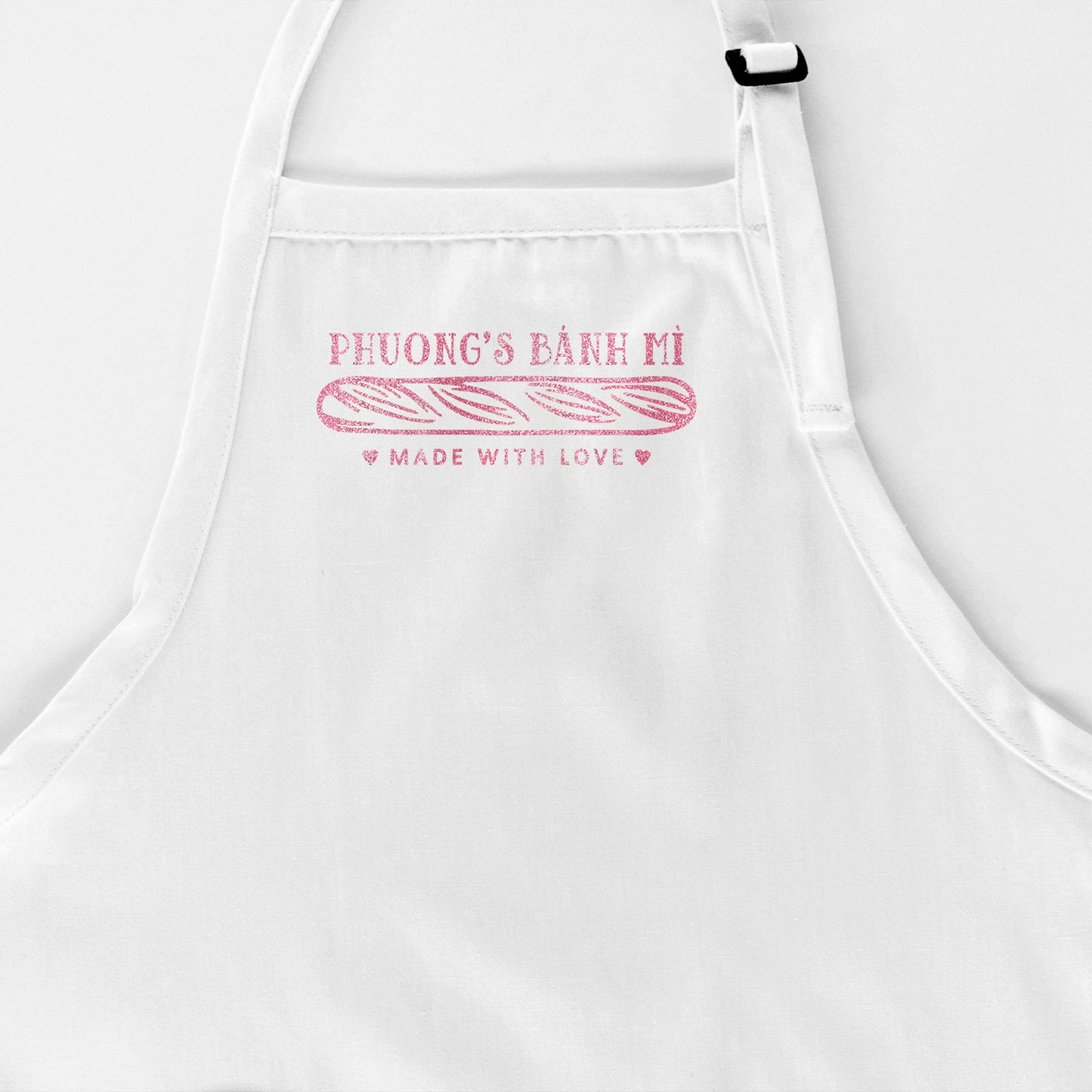 
                  
                    a personalized bread baking apron in white
                  
                