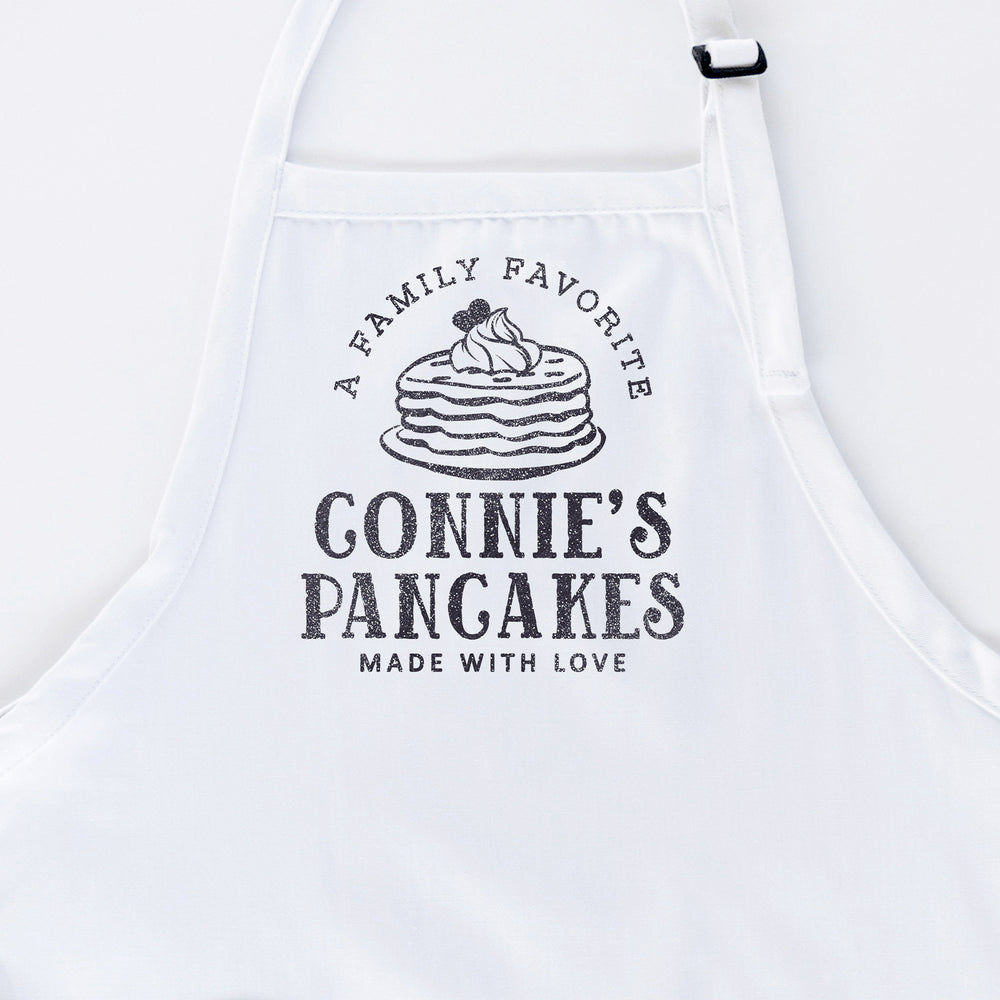 
                  
                    a personalized pancake apron in white
                  
                