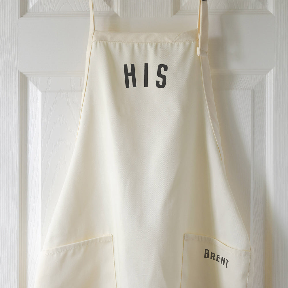 
                  
                    a personalized His apron in natural
                  
                