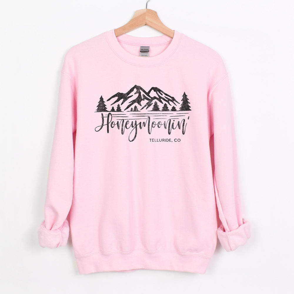 
                  
                    a honeymoonin' custom location sweatshirt in light pink
                  
                