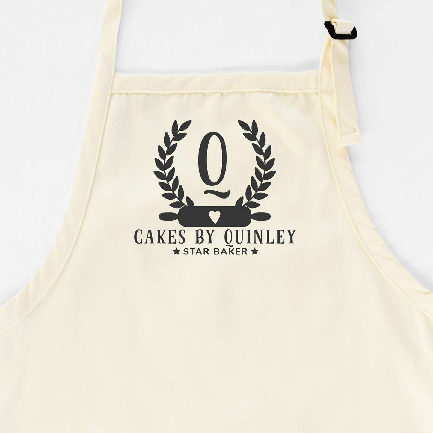 
                  
                    a personalized monogrammed baking apron in natural
                  
                