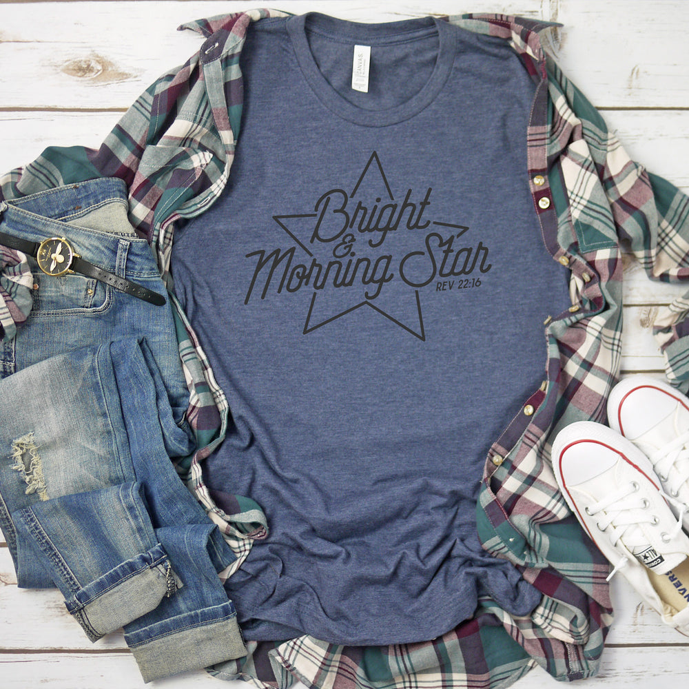 
                  
                    bright-morning-star-svg printed on a blue tee, with jeans, a flannel and converse shoes
                  
                