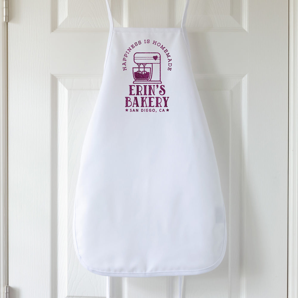 
                  
                    a kids personalized baking apron in white
                  
                